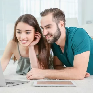 young-couple-searching-information-using-laptop-home-1920w
